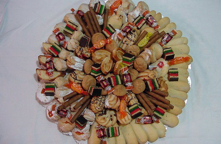 A plate of assorted cookies and candies on a table