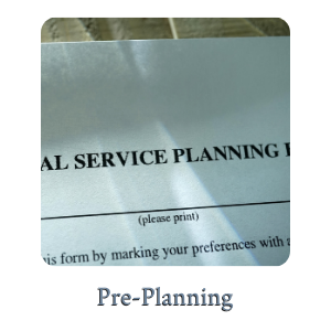 Close-up of a form titled “Pre-Planning” with “(please print)” visible on the page.