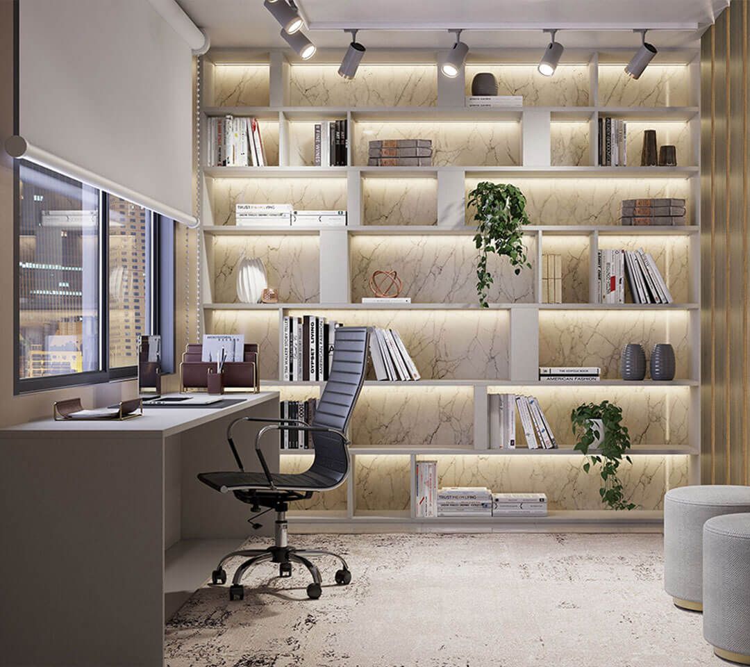 Una habitación con un escritorio, una silla y estantes llenos de libros.