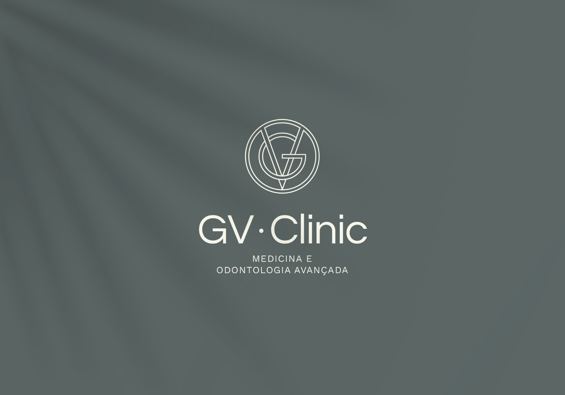 O logotipo da clínica gv está em um fundo cinza.