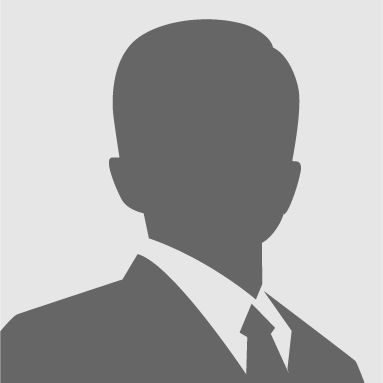 Silhouette of a person in a suit and tie on a gray background