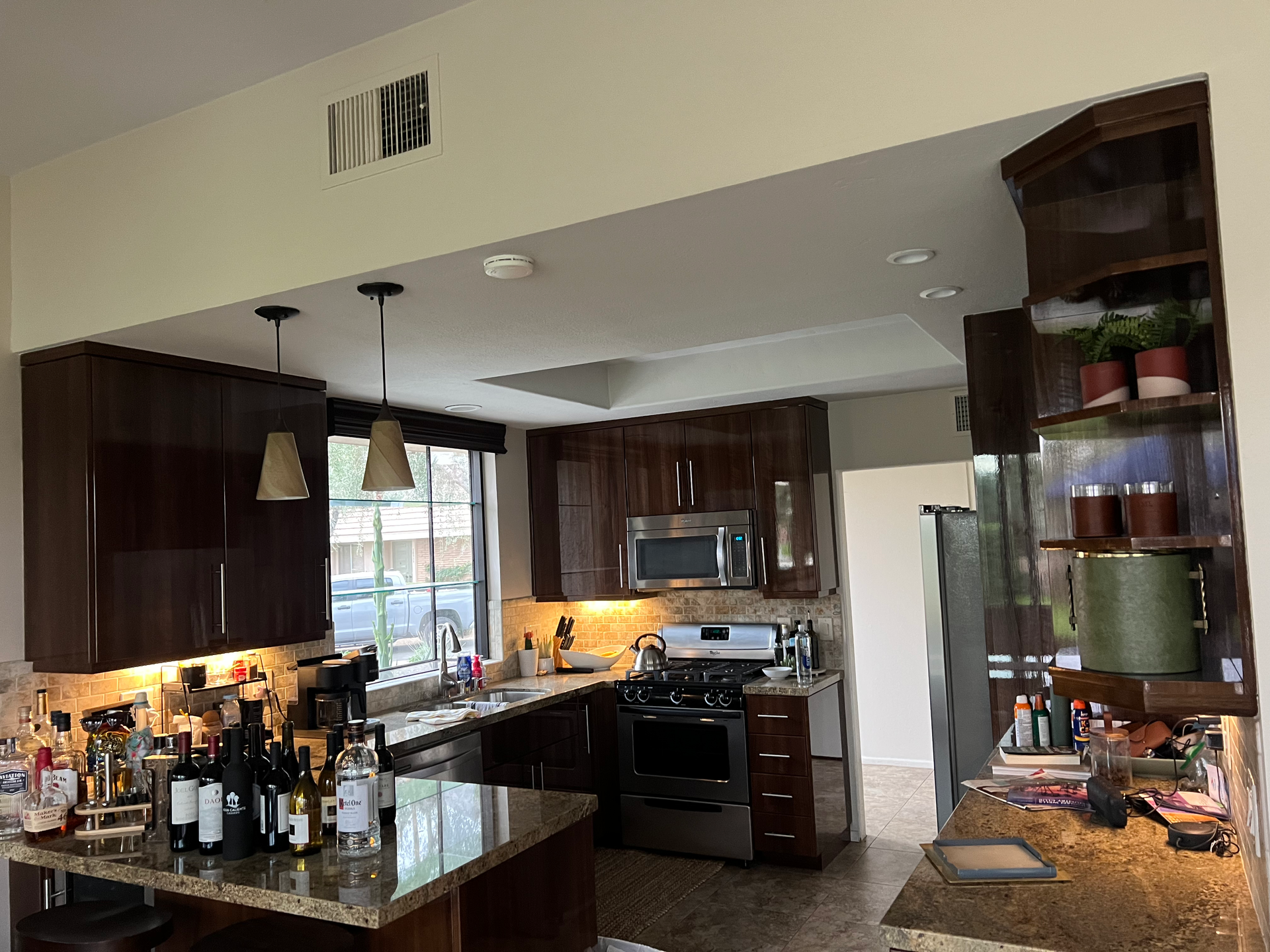 A kitchen with stainless steel appliances and wooden cabinets