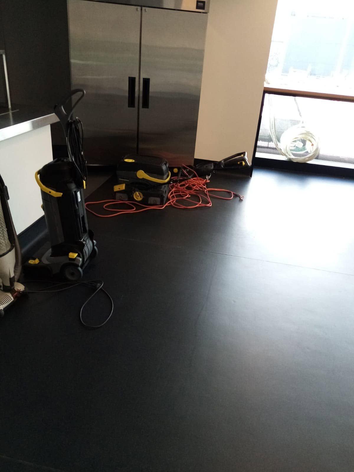 Professional cleaning equipment prepared for a commercial interior