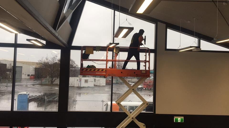 High-access cleaning in a commercial building