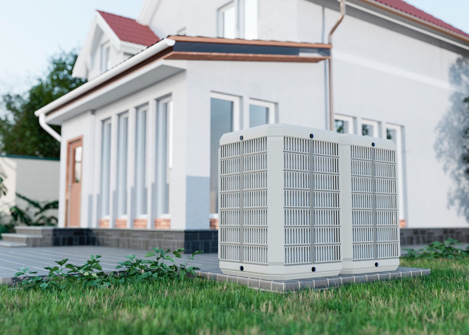 Outdoor air conditioner unit beside a modern white house with a red roof and green lawn