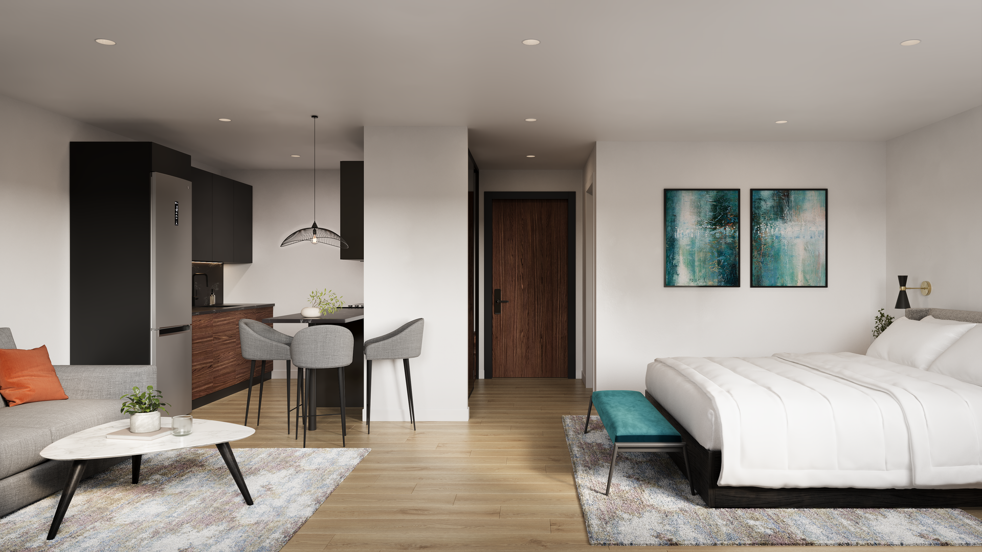 Modern studio apartment with kitchen, living area, and bedroom; neutral tones.