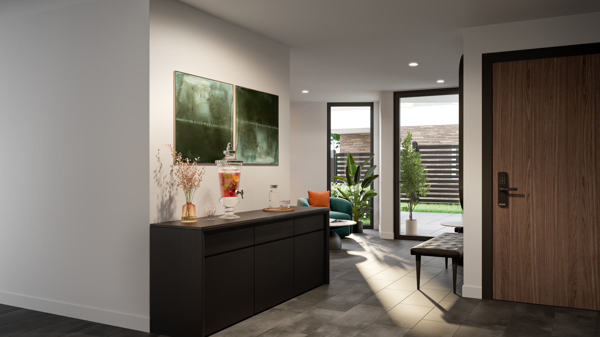 Entryway with dark console, art, and open door to a patio.