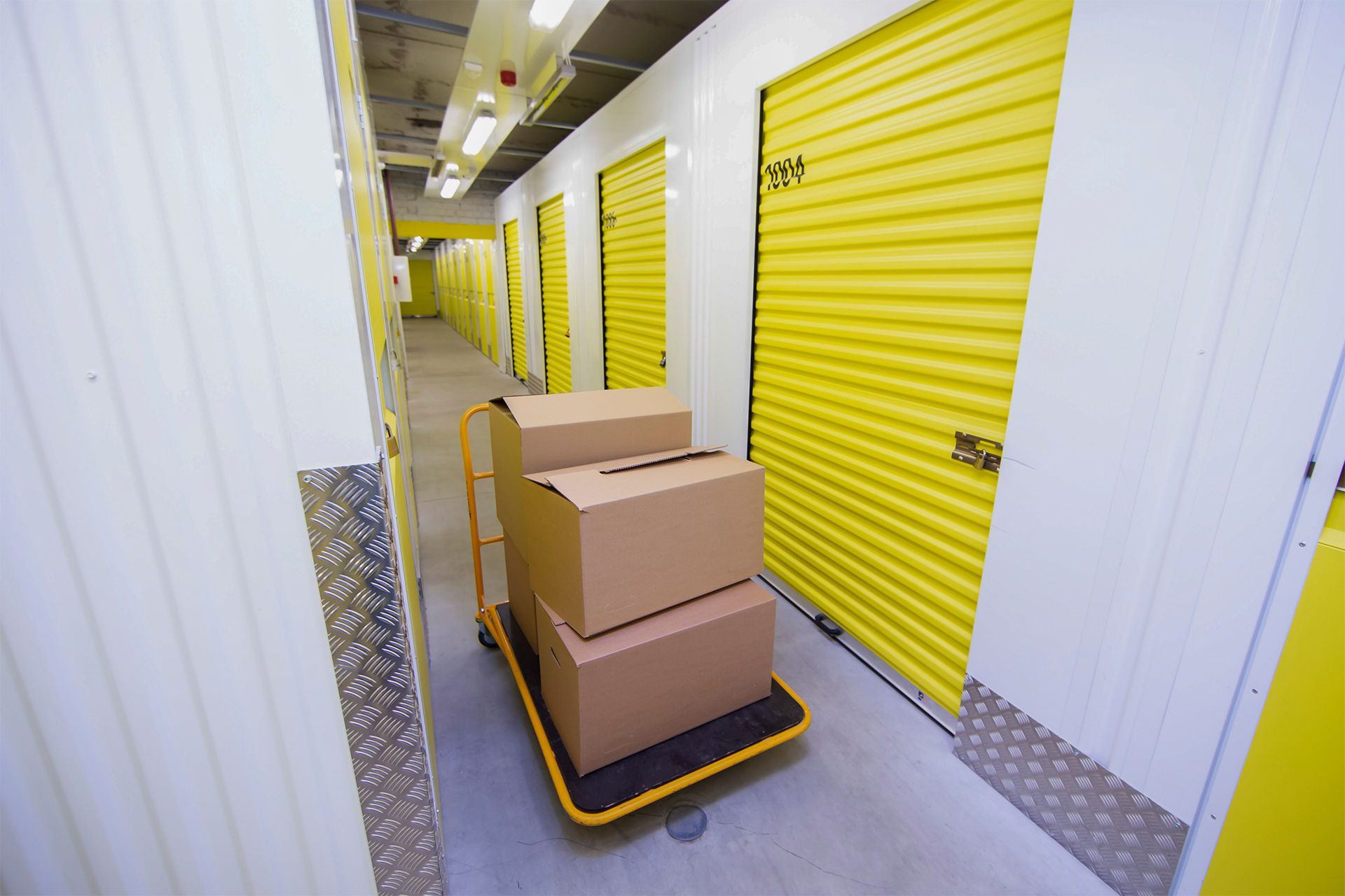 Cart With Boxes in Storage Hallway