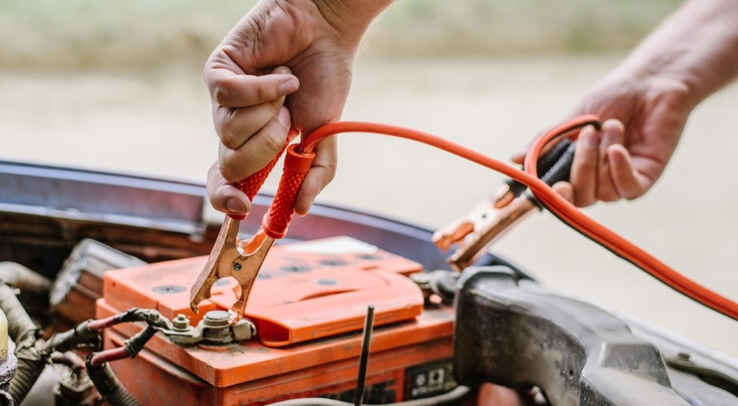 Roadside assistance technician servicing a dead battery