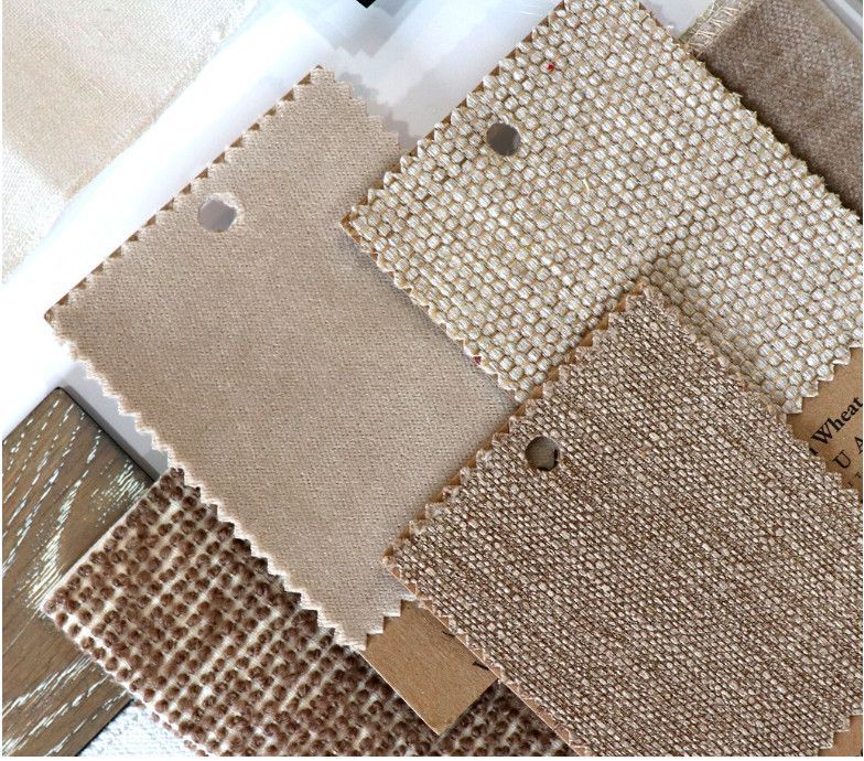 Assorted beige and brown fabric swatches with textured patterns, arranged in overlapping squares.