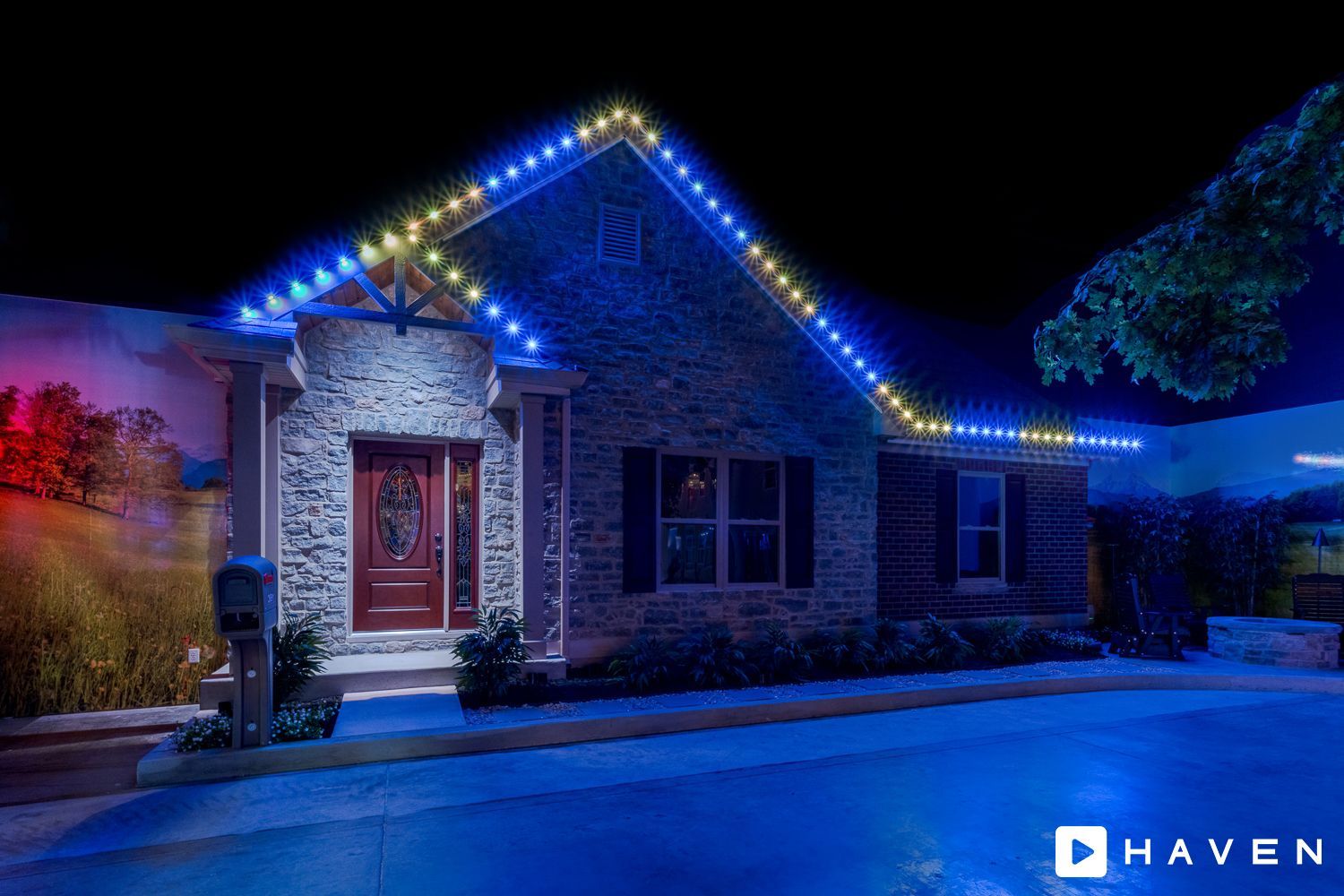 A house with christmas lights on the roof is lit up at night.