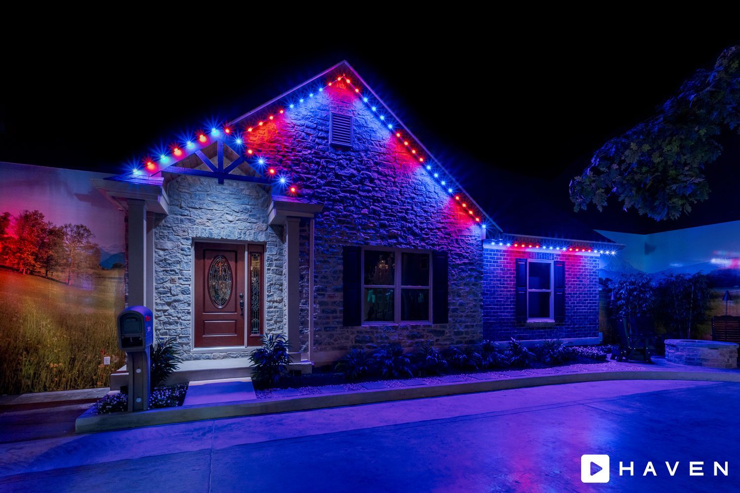 A house with red , white and blue lights on it at night.