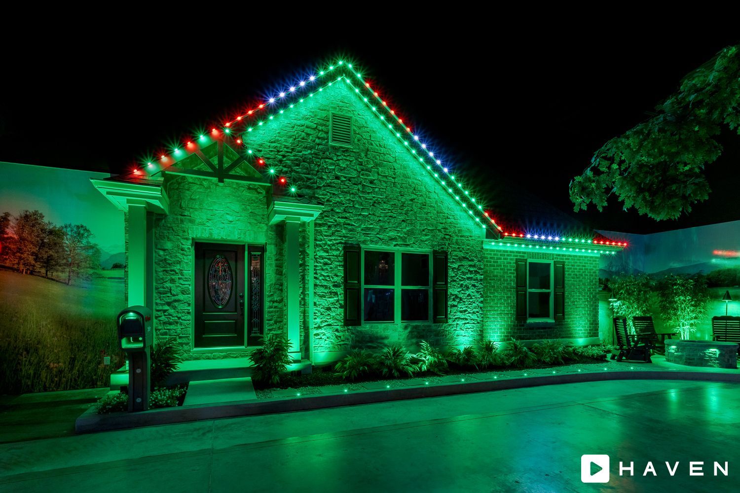 A house is decorated with green and red christmas lights.