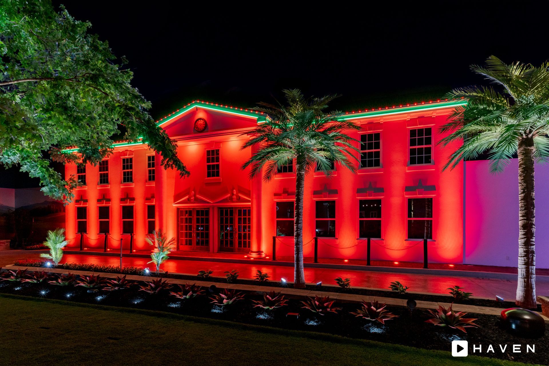 A large red building with christmas lights on it