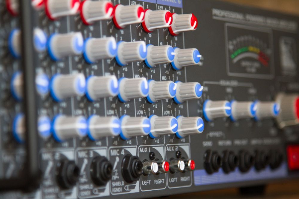 A Close Up of a Mixer With a Bunch of Knobs on It — Atherton Electrical in Atherton, QLD
