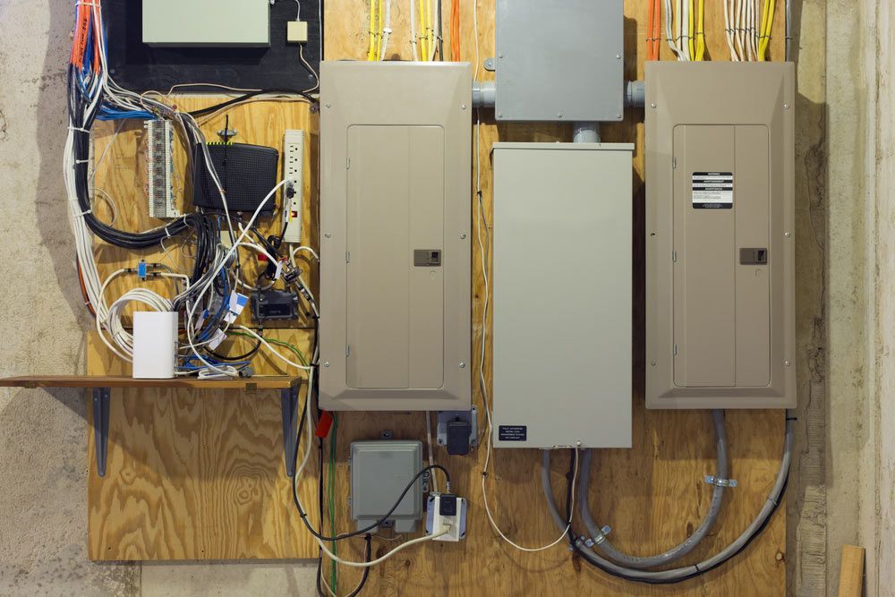 A Wall With Electrical Boxes and Wires on It — Atherton Electrical in Atherton, QLD