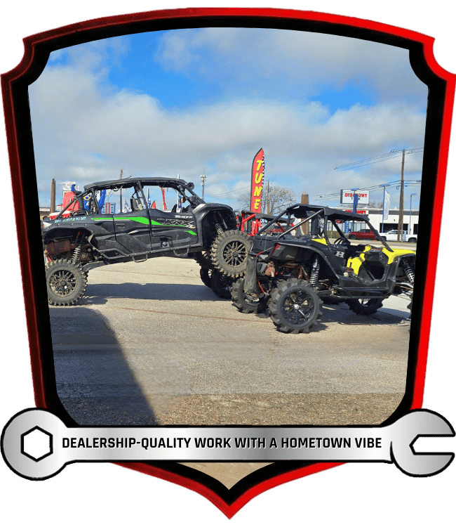 Lifted Hisun and Kawasaki side-by-side off-road vehicles outdoor