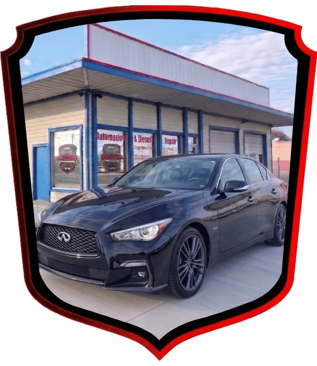 Black Infiniti luxury sedan parked outside WrenchWerks automotive repair shop