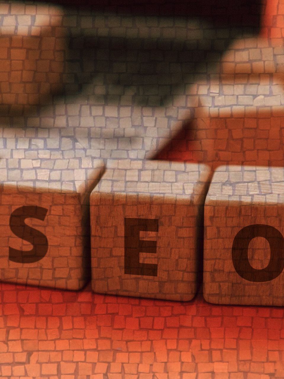 SEO Wrexham and the word seo is written on a wooden block