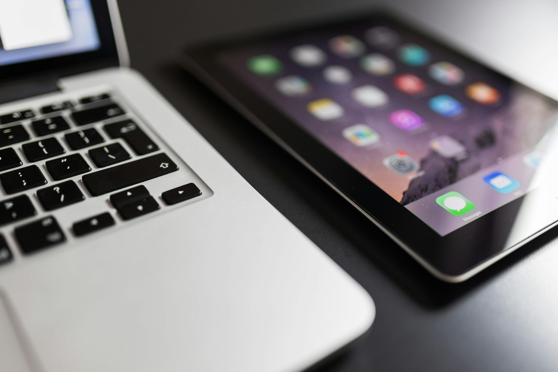 A laptop and a mobile tablet are on a table