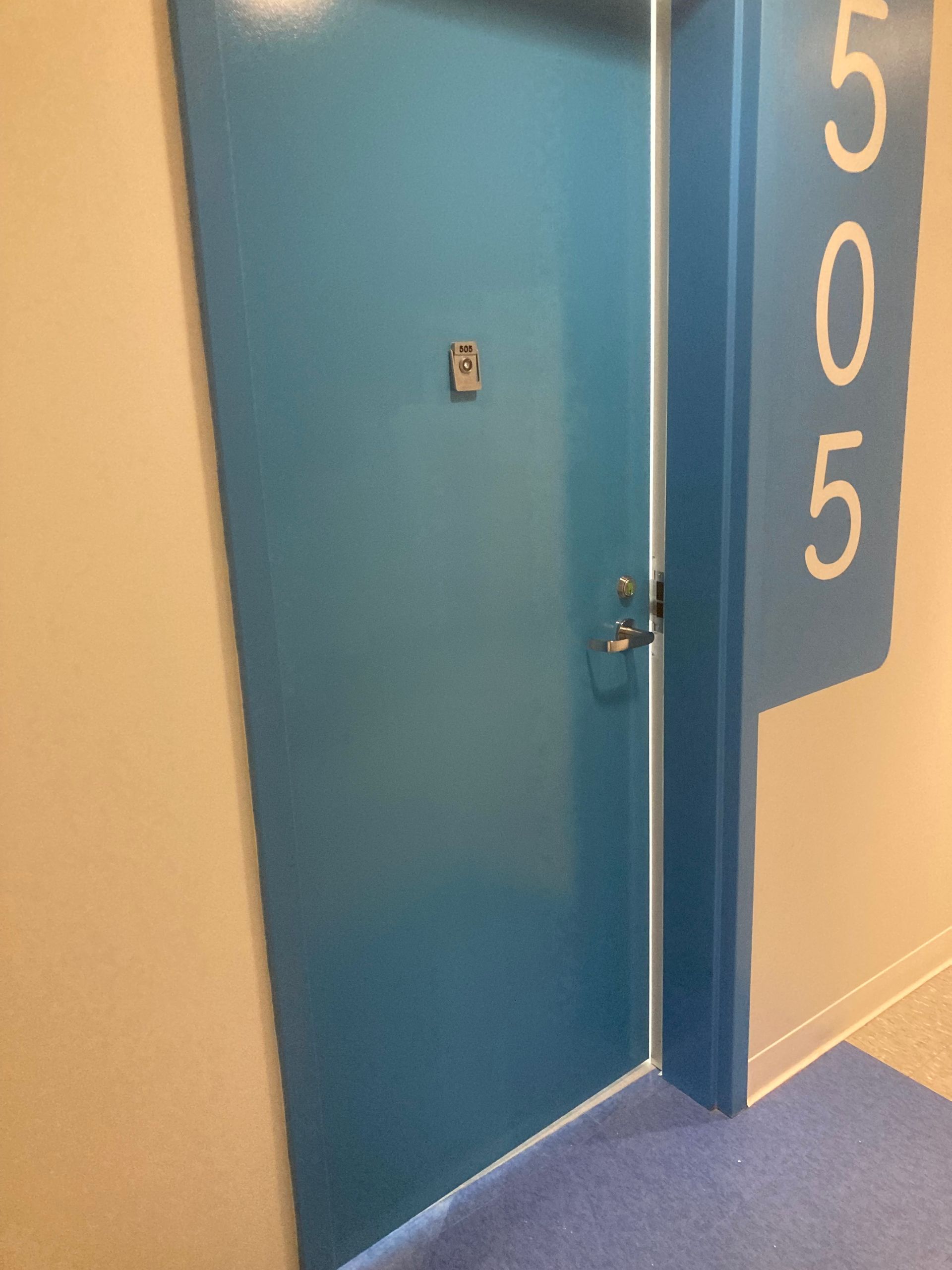 A blue door with the number 5 on it