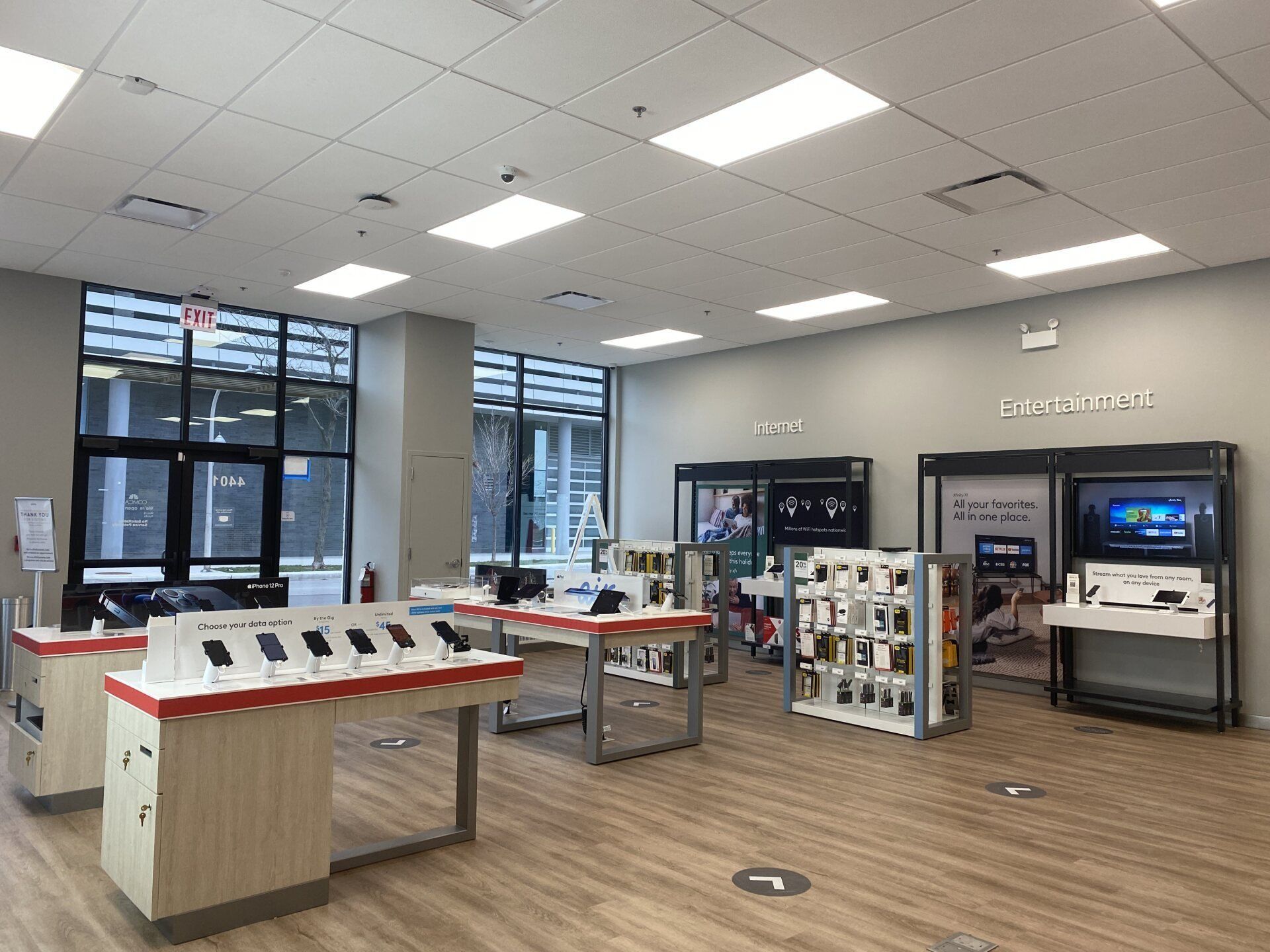 A store filled with lots of tables and displays of cell phones.