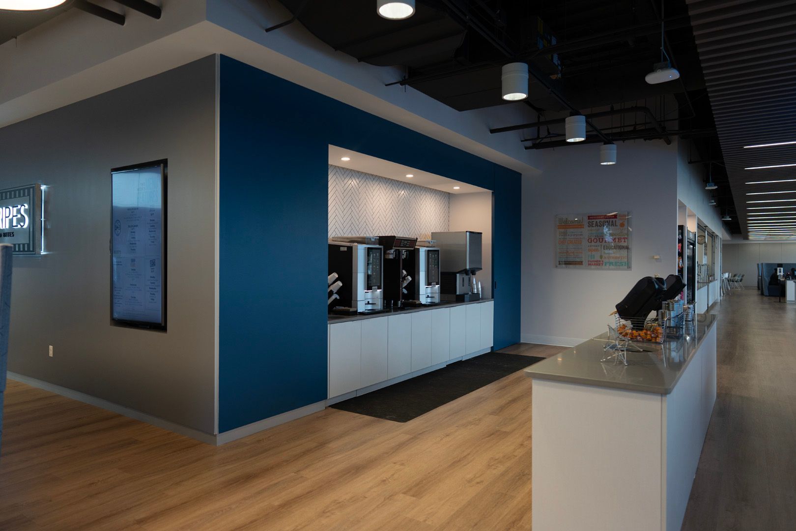 A large room with a blue wall and a counter.