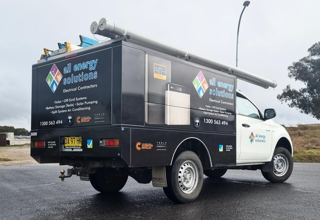 A Black and White Truck is Parked on the Side of the Road — Robinsons Sign Makers in Lavington, NSW