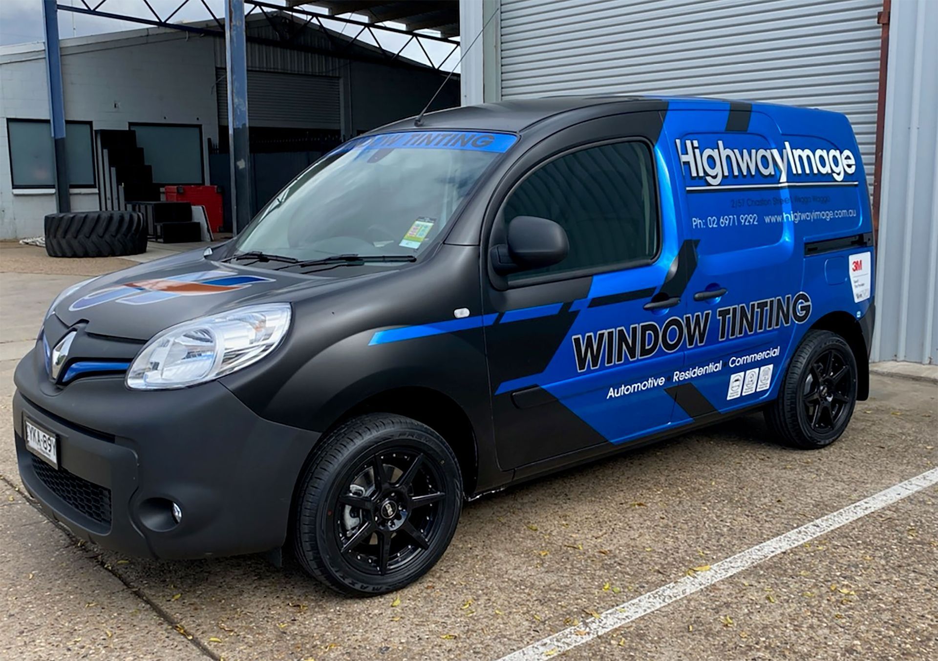 A Blue and Black Van is Parked in a Parking Lot — Robinsons Sign Makers in Lavington, NSW