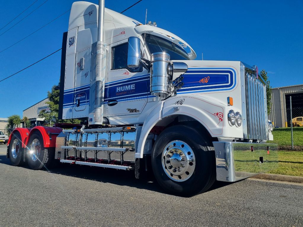 A White Semi Truck With a Red Trailer is Parked on the Side of the Road — Robinsons Sign Makers in Shepparton, VIC