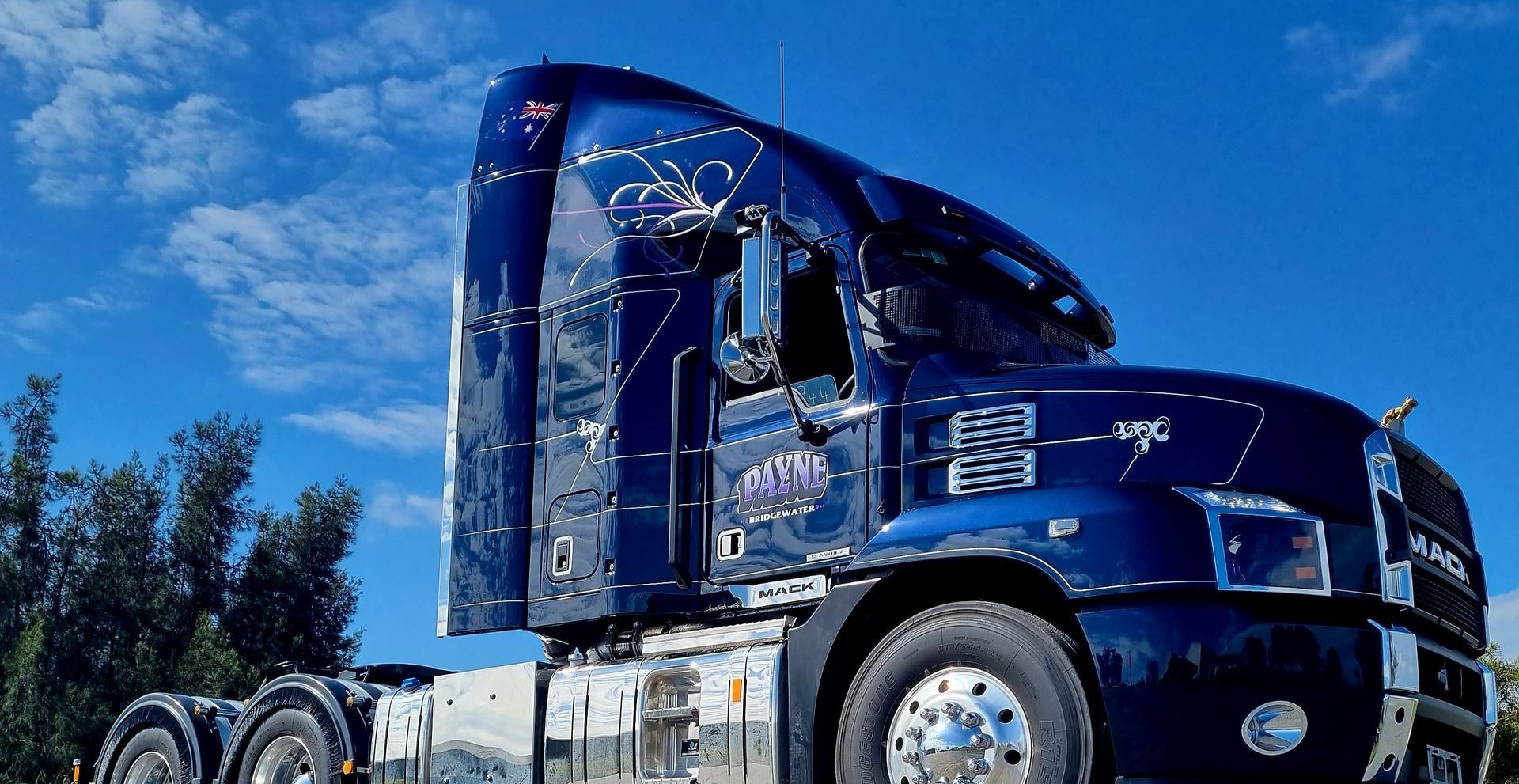 A Navy Blue Truck With Personalised Signage — Robinsons Sign Makers in Lavington, NSW