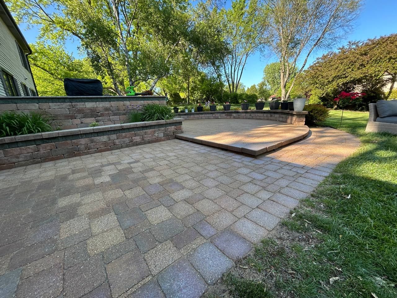 picture of a paver stone patio that was restored here in Highland Park, IL. You can see a multilevel paver patio that was just sealed and sanded.