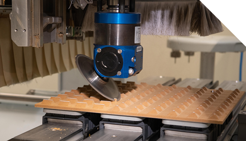A person is using a circular saw to cut a piece of wood