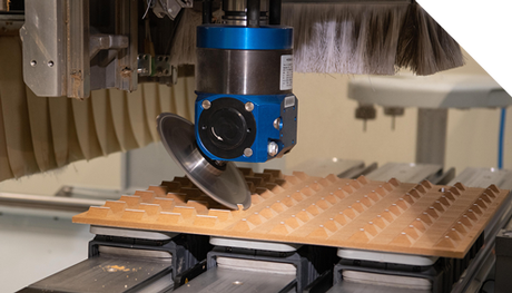 A person is using a circular saw to cut a piece of wood