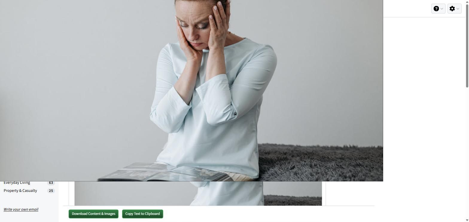 Worried woman holding her head while reviewing paperwork on her bed