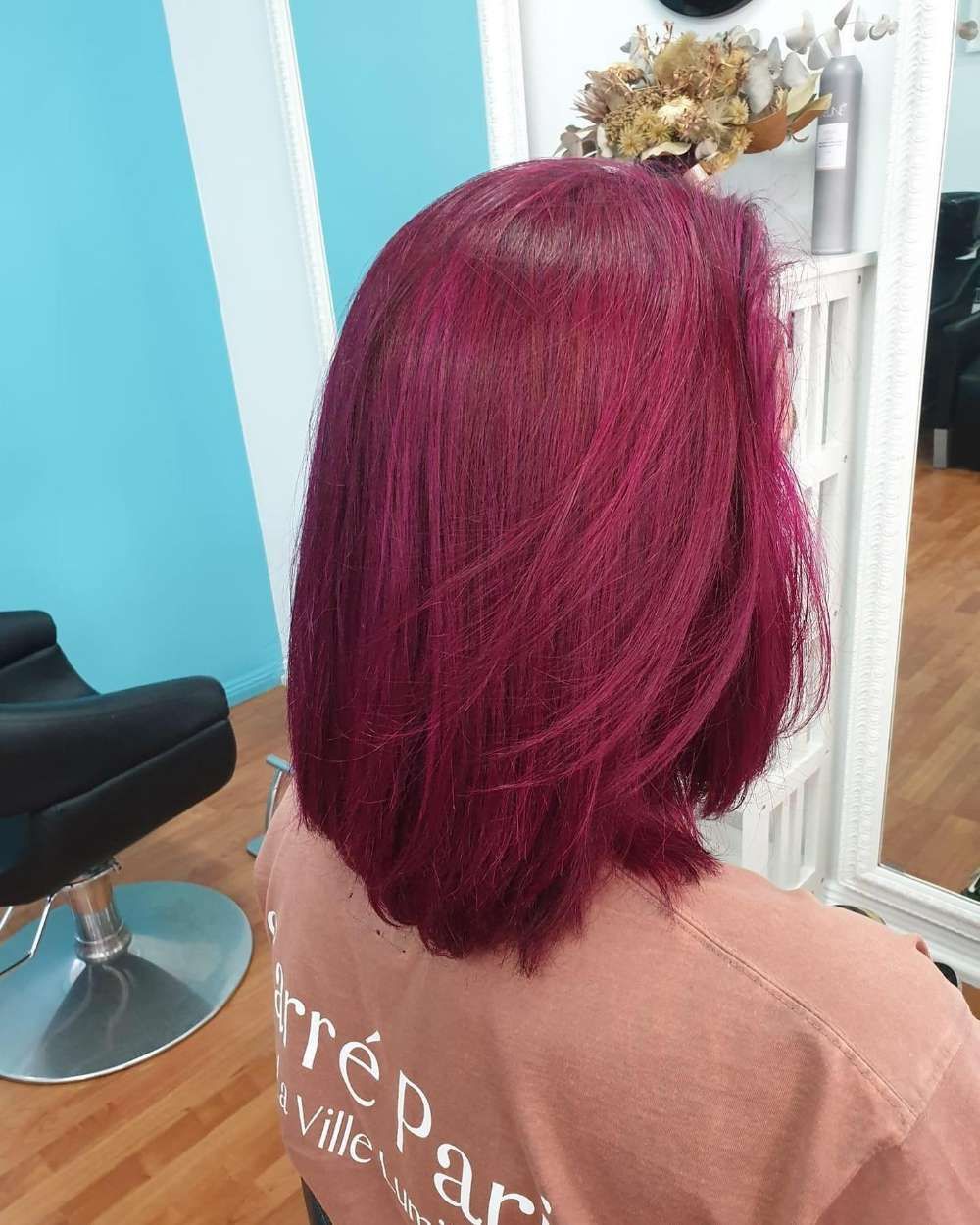 A Woman With Purple Hair is Wearing a Shirt That Says — Innovative Hair Salon in Gosford, NSW