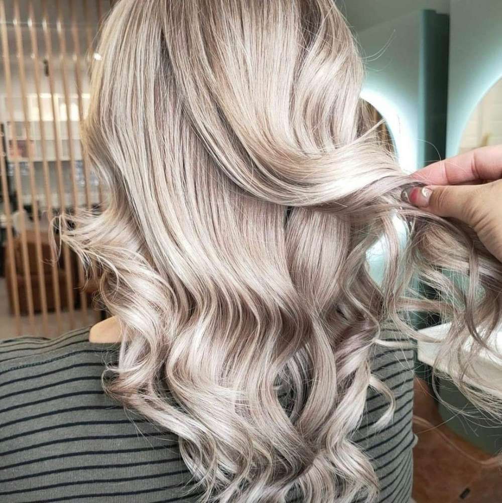 A Woman is Getting Her Hair Done in a Salon — Innovative Hair Salon in Gosford, NSW