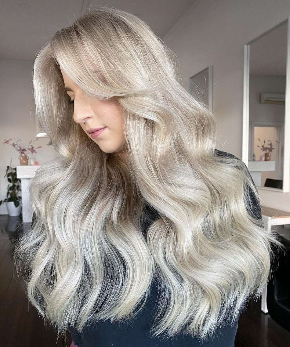 A Person With Long Blonde Hair — Innovative Hair Salon in Gosford, NSW