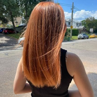 A Person With Long Red Hair — Innovative Hair Salon in Gosford, NSW
