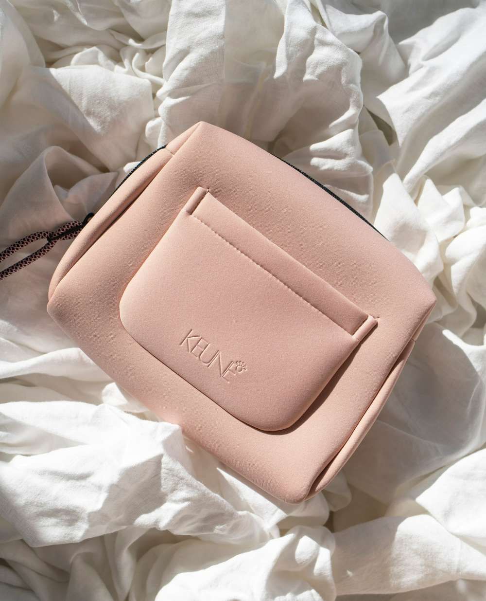 A Pink Purse With the Word Keune on It — Innovative Hair Salon in Gosford, NSW