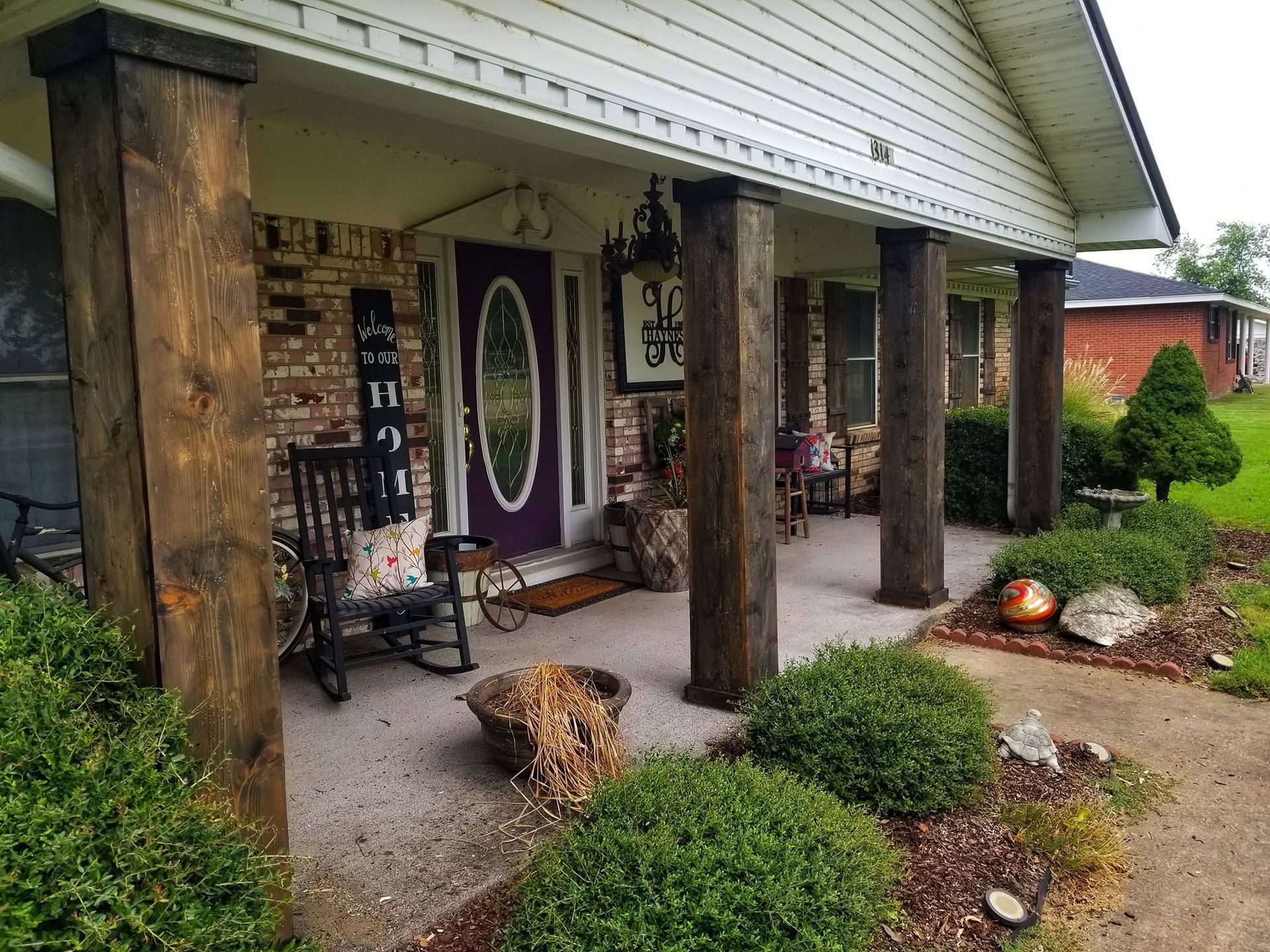 stained wooden beams on front porch