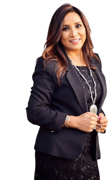 Professional woman in a black blazer smiling and holding a glass award on a white background