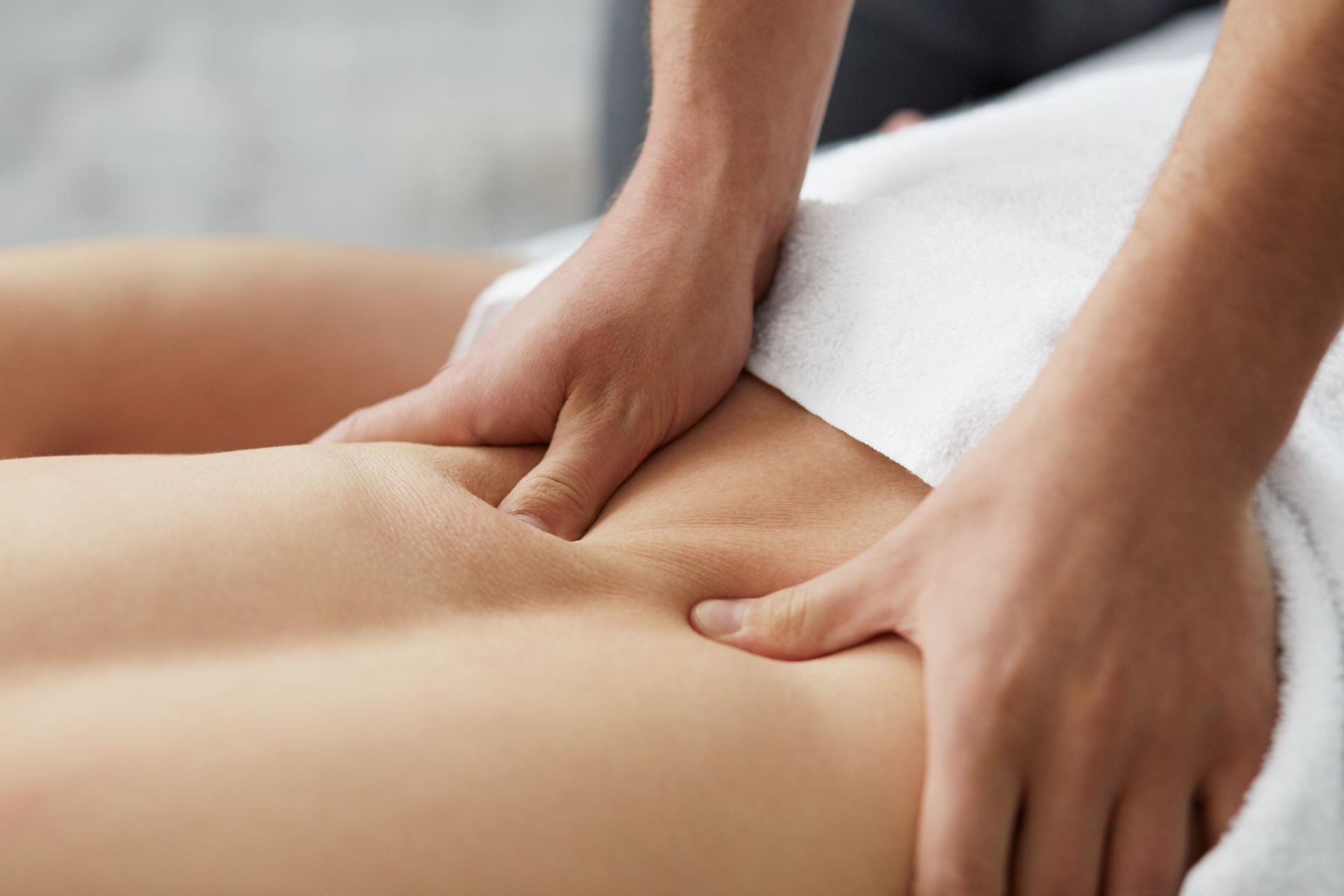 Young handsome man enjoying a back massage. 