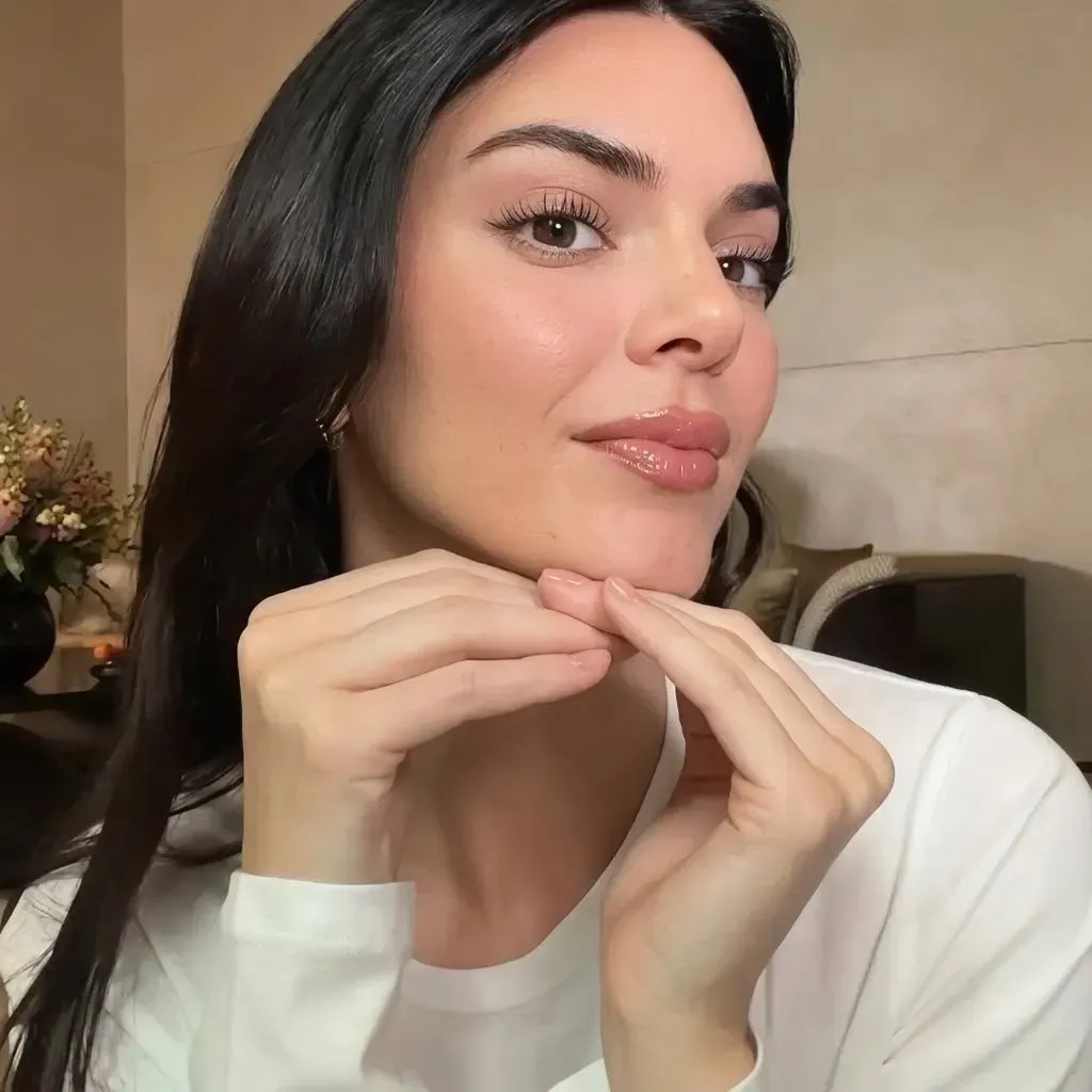 Close-up of combo brows showing fine hairstrokes blending into soft powder shading