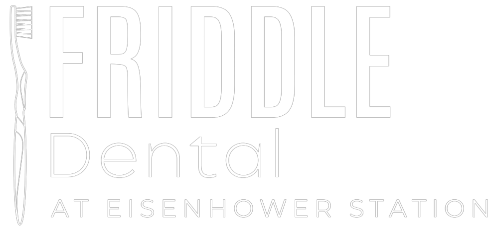 White Friddle Dental logo with stylized tooth and “At Eisenhower Station” text