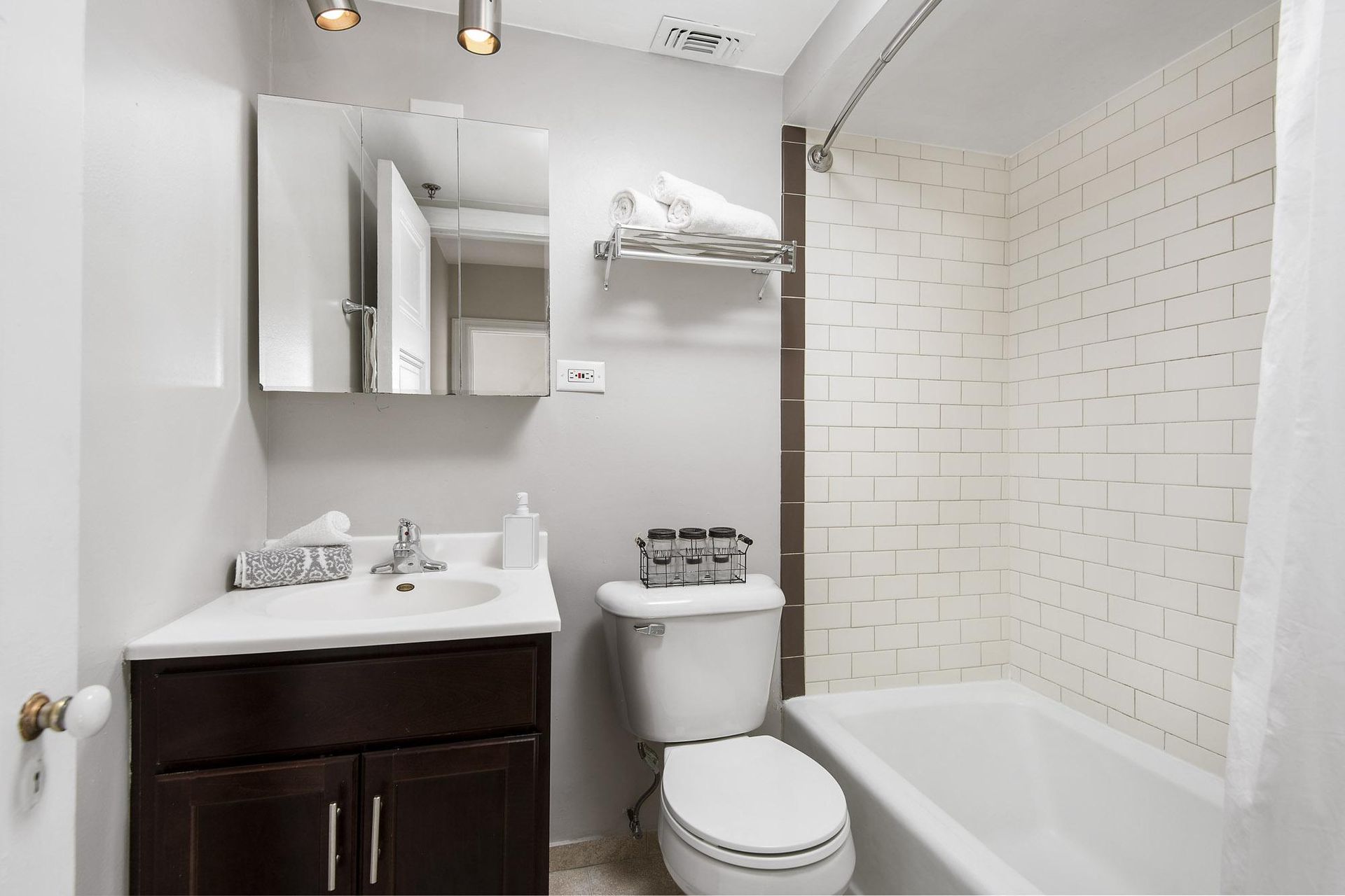 a bathroom with a sink toilet and a bath tub