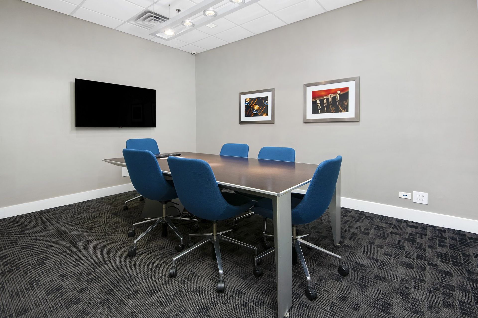 a conference room with a table and chairs