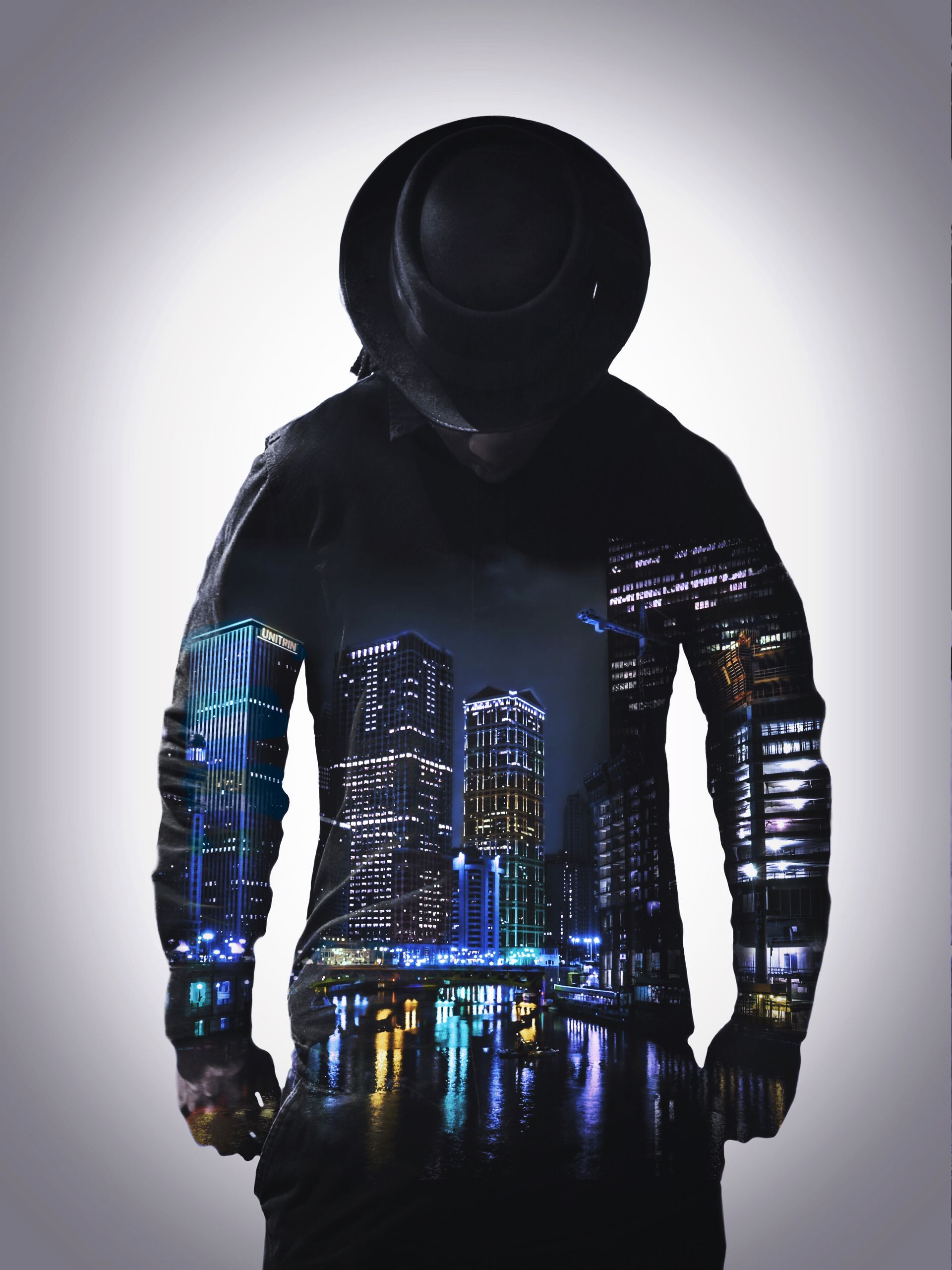 Silhouetted figure in a dark hooded jacket with a glowing city skyline reflection and neon accents.