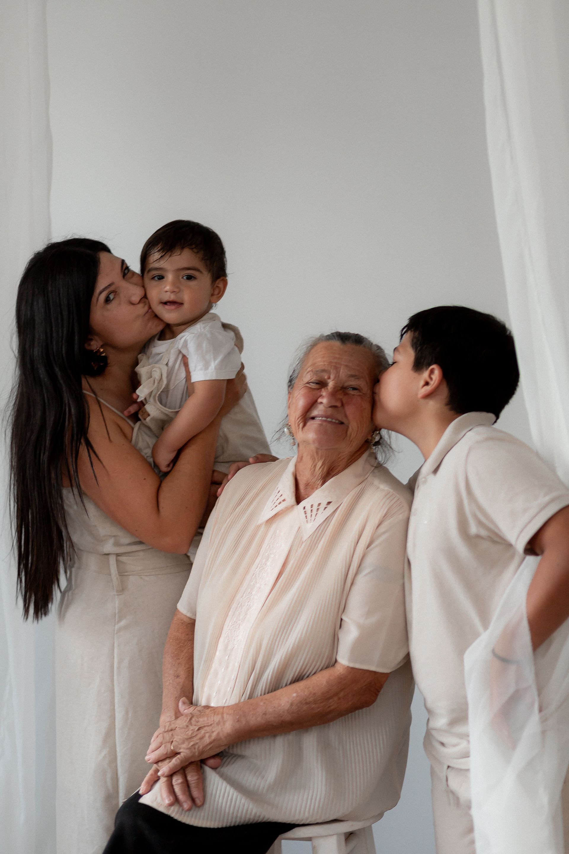 Grandparent sharing a joyful moment with family during a multigenerational portrait session in New Jersey