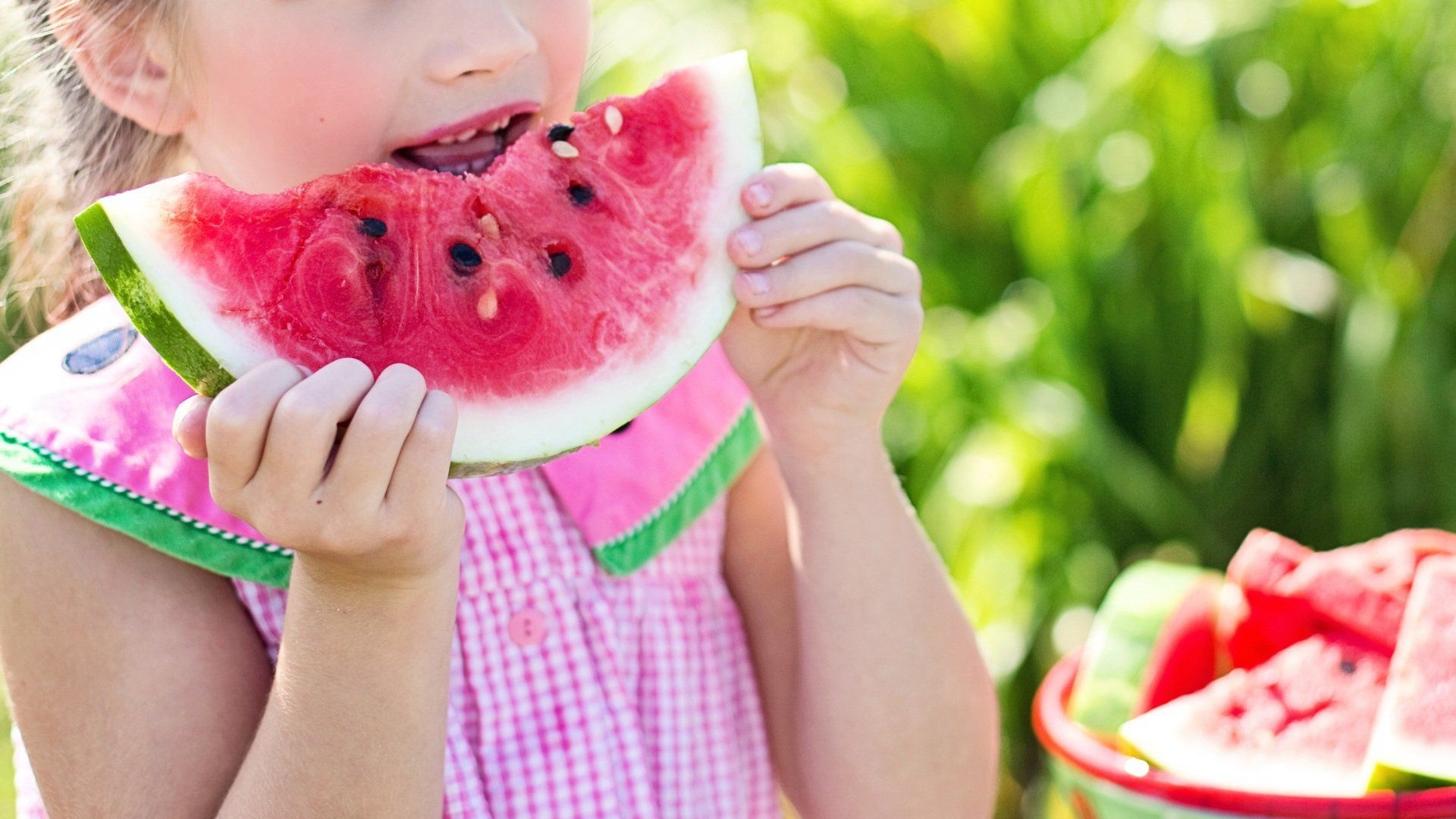 Girl eating watermelon slice